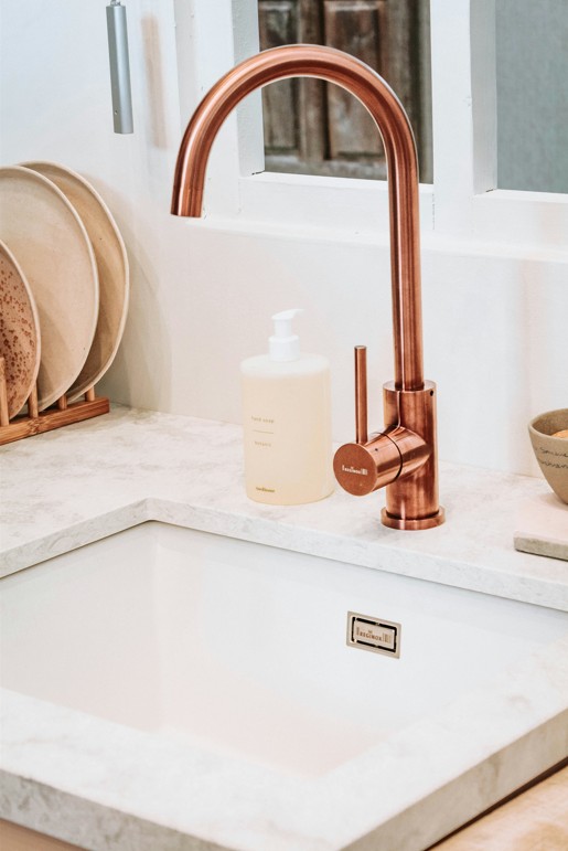 Sink with copper tap